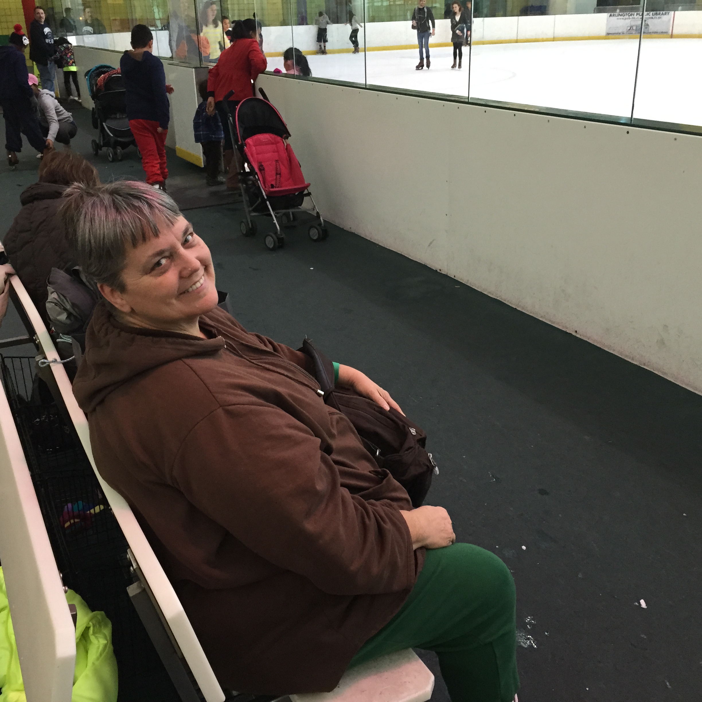 Mom chilling on the bench while waiting for me to finish skating