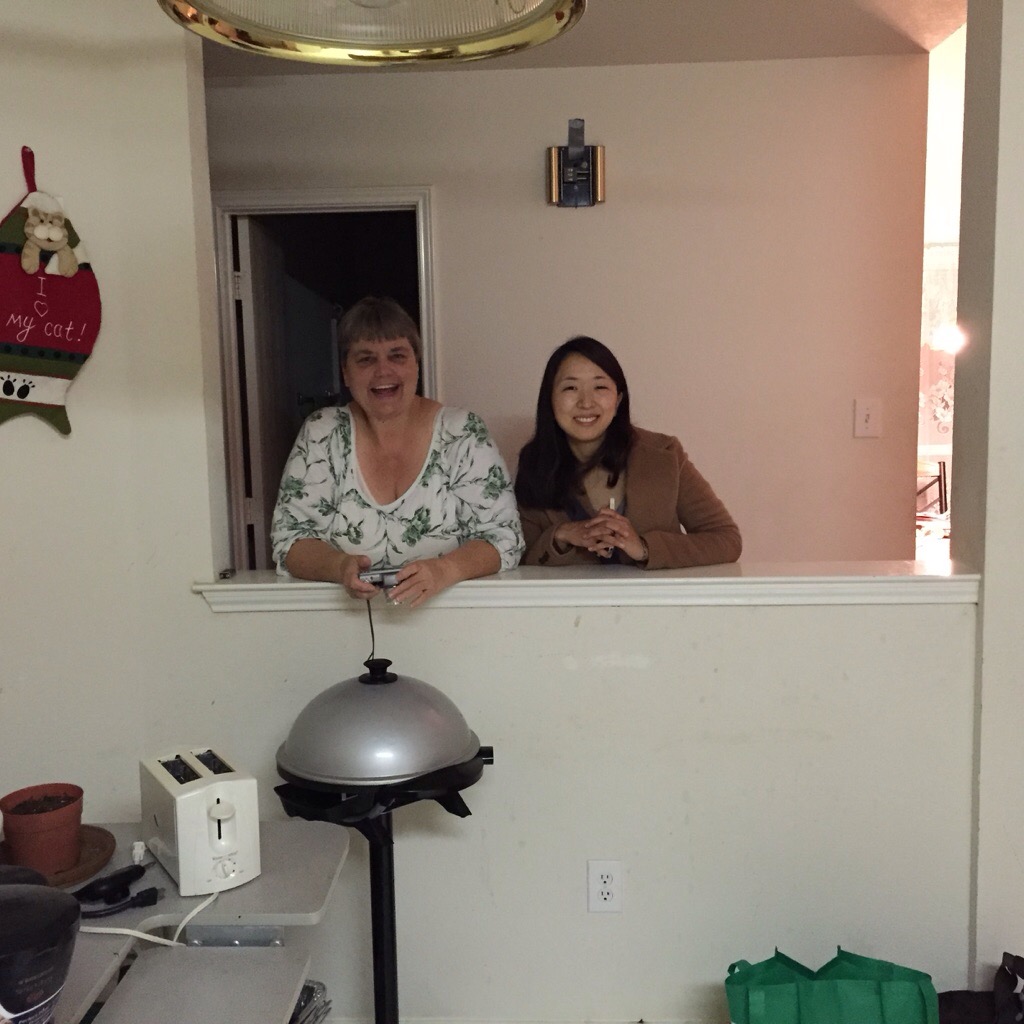 Mom and Akiko watching me cook for them