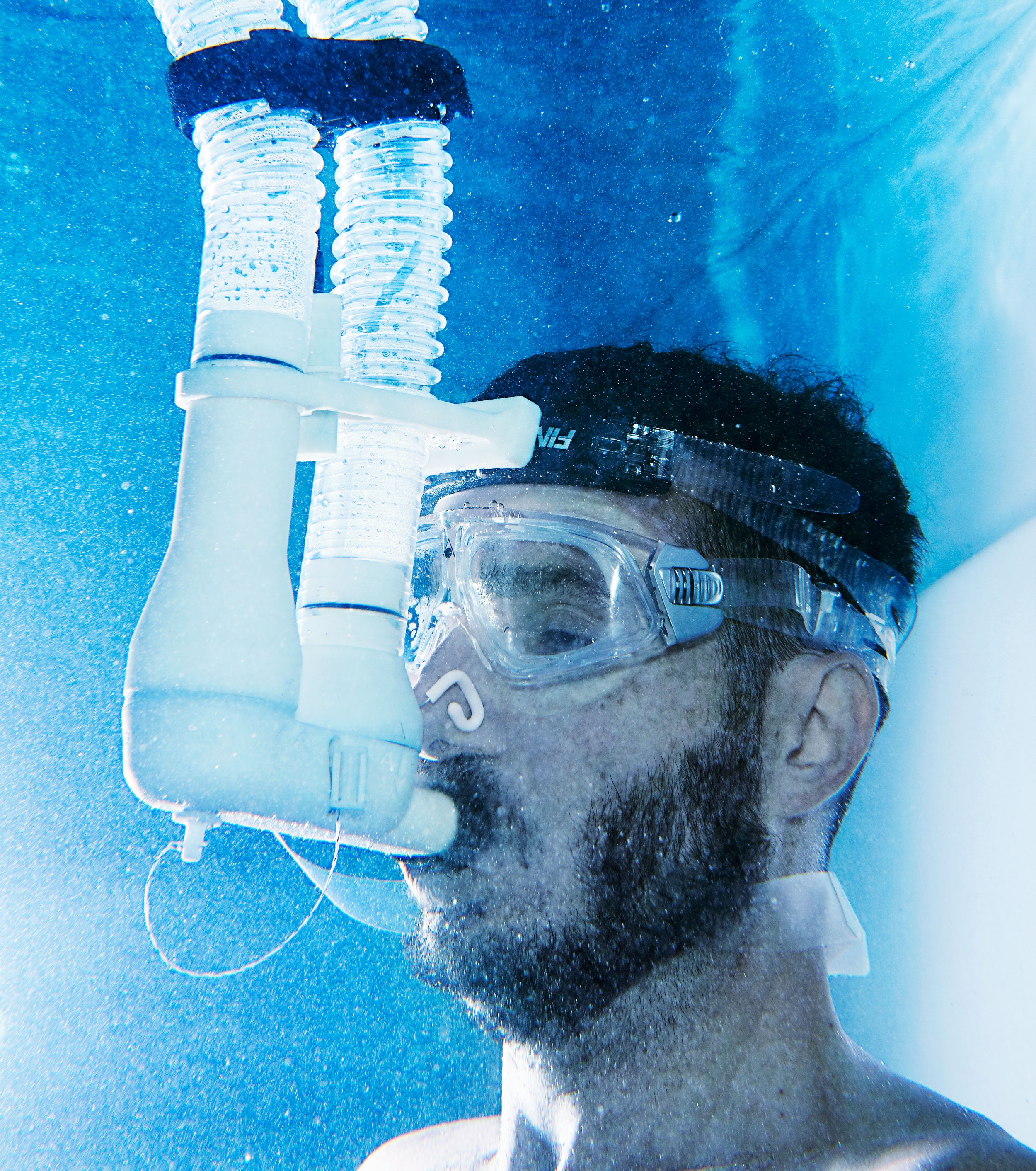 The Cosmed Quark CPET, a $30,000 snorkel contraption, analyzes writer Steven Leckart’s breathing to chart how the cold water is affecting his metabolism.PHOTOGRAPH: ANDREW TINGLE